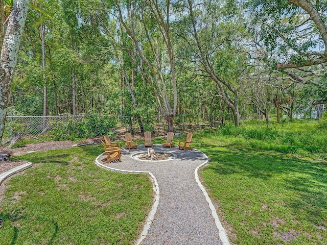 8711 Crescent Forest Blvd, New Port Richey, FL 34654 - view of yard featuring an outdoor fire pit