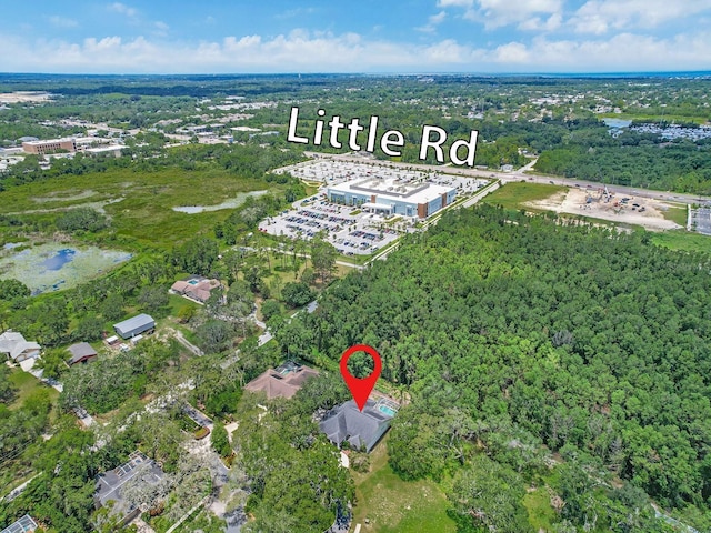 8711 Crescent Forest Blvd, New Port Richey, FL 34654 - aerial view of property's location with a heavily wooded area