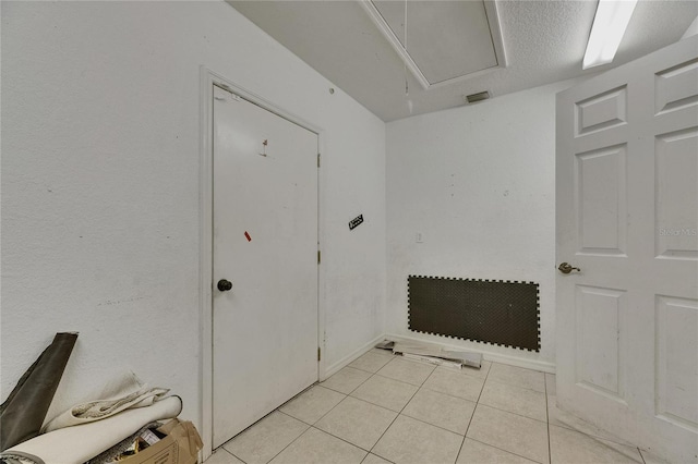 9041 58th St N, Pinellas Park, FL 33782 - unfurnished room featuring light tile patterned flooring and attic access