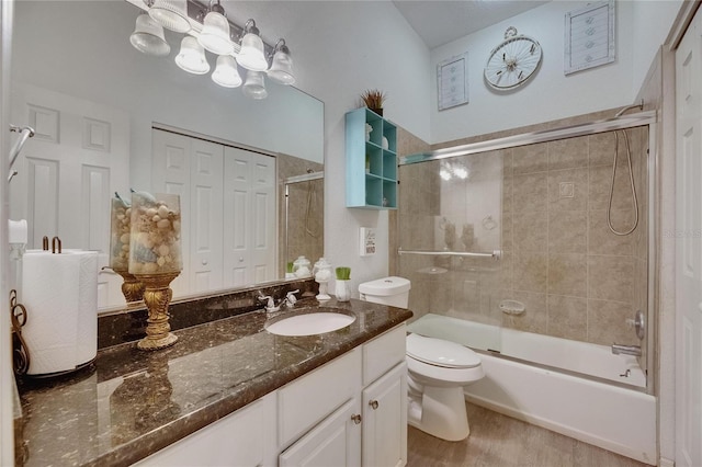 9041 58th St N, Pinellas Park, FL 33782 - full bath with vanity, combined bath / shower with glass door, and wood finished floors