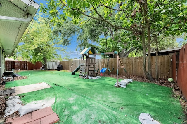 9041 58th St N, Pinellas Park, FL 33782 - fenced backyard featuring a playground
