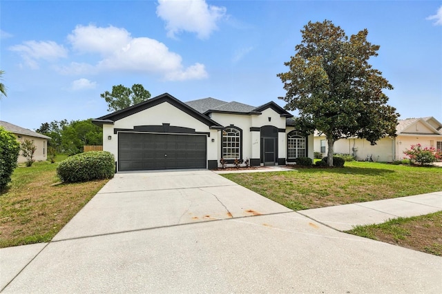 5390 Greystone Dr, Spring Hill, FL 34609 - view of front facade with a garage, a front lawn, stucco siding, and driveway