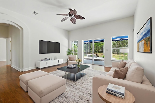 5390 Greystone Dr, Spring Hill, FL 34609 - living room with wood finished floors, a ceiling fan, and arched walkways