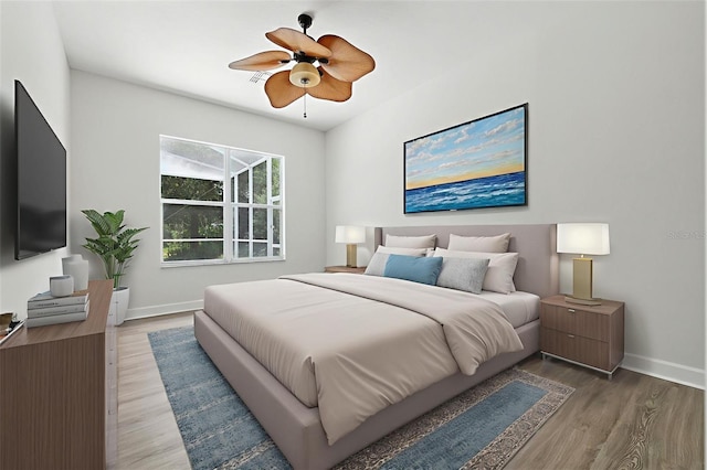 5390 Greystone Dr, Spring Hill, FL 34609 - bedroom with wood finished floors and a ceiling fan