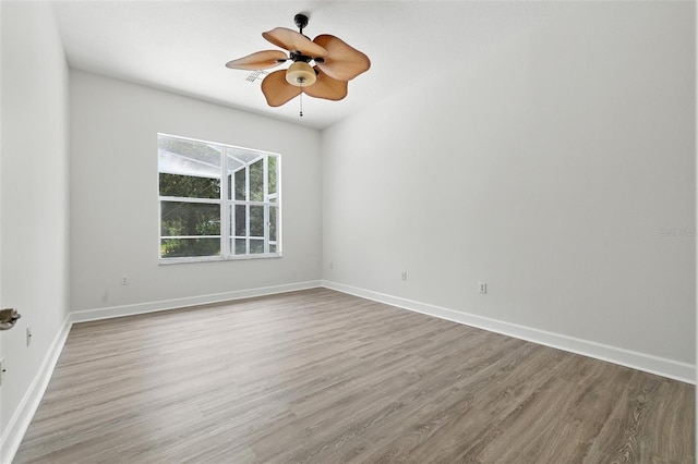 5390 Greystone Dr, Spring Hill, FL 34609 - unfurnished room featuring wood finished floors and a ceiling fan