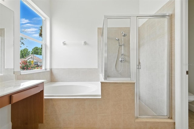 5390 Greystone Dr, Spring Hill, FL 34609 - bathroom featuring a stall shower, a garden tub, and vanity