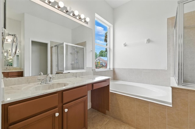 5390 Greystone Dr, Spring Hill, FL 34609 - full bathroom with a shower stall, vanity, tile patterned floors, and a bath