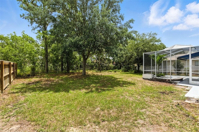 5390 Greystone Dr, Spring Hill, FL 34609 - view of green lawn featuring glass enclosure