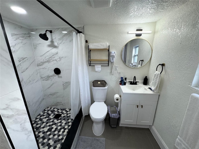 2509 Thornbrook Pl, Tampa, FL 33618 - full bathroom with a textured wall, vanity, tiled shower, a textured ceiling, and tile patterned floors