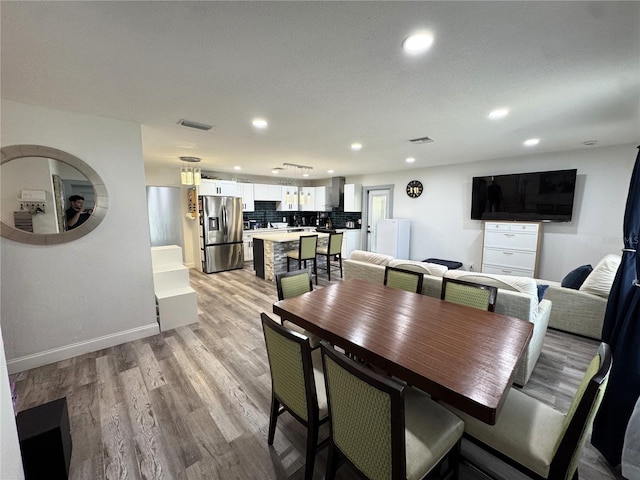 2509 Thornbrook Pl, Tampa, FL 33618 - dining room featuring recessed lighting and light wood-type flooring