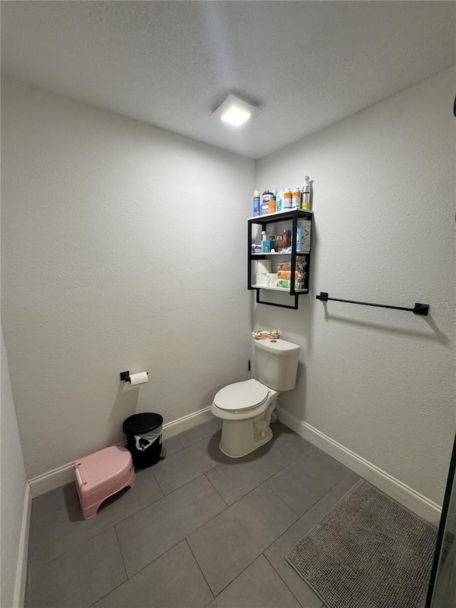 2509 Thornbrook Pl, Tampa, FL 33618 - bathroom with tile patterned flooring and a textured ceiling