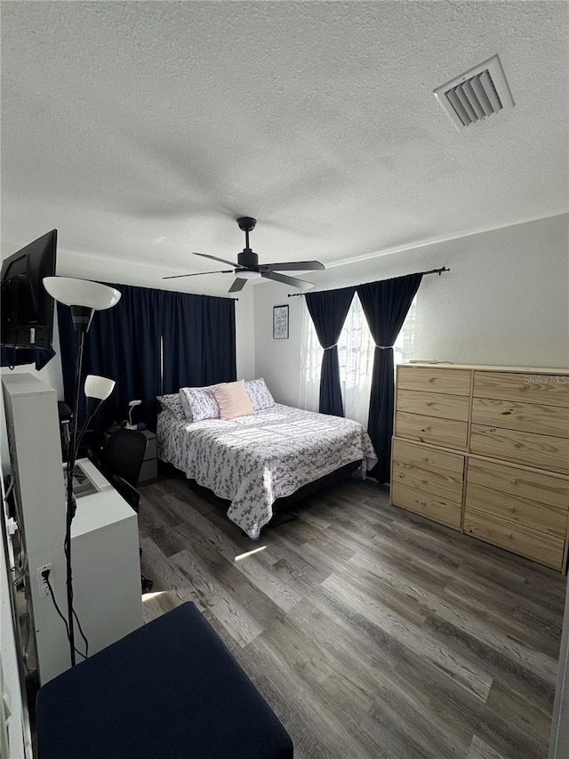 2509 Thornbrook Pl, Tampa, FL 33618 - bedroom featuring a textured ceiling, wood finished floors, and a ceiling fan