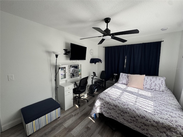 2509 Thornbrook Pl, Tampa, FL 33618 - bedroom with wood finished floors, a textured ceiling, and a ceiling fan