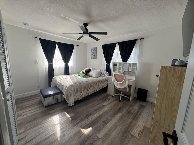 2509 Thornbrook Pl, Tampa, FL 33618 - bedroom with a textured ceiling, wood finished floors, and a ceiling fan