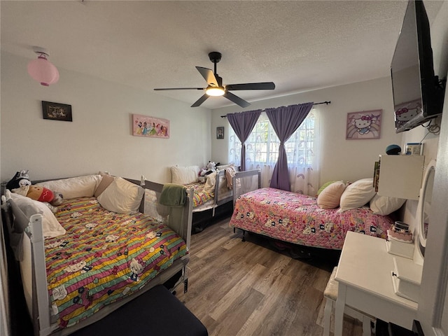 2509 Thornbrook Pl, Tampa, FL 33618 - bedroom with wood finished floors, a textured ceiling, and ceiling fan