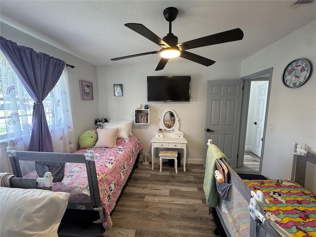 2509 Thornbrook Pl, Tampa, FL 33618 - bedroom featuring wood finished floors, ceiling fan, and a textured ceiling