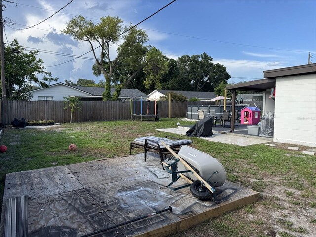 2509 Thornbrook Pl, Tampa, FL 33618 - fenced backyard with a trampoline and a patio area