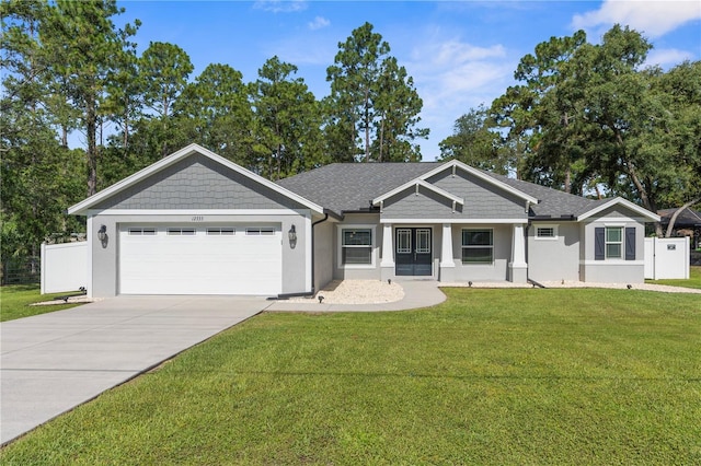 12333 Harris Hawk Rd, Weeki Wachee, FL 34614 - view of front of house featuring stucco siding, a garage, and driveway