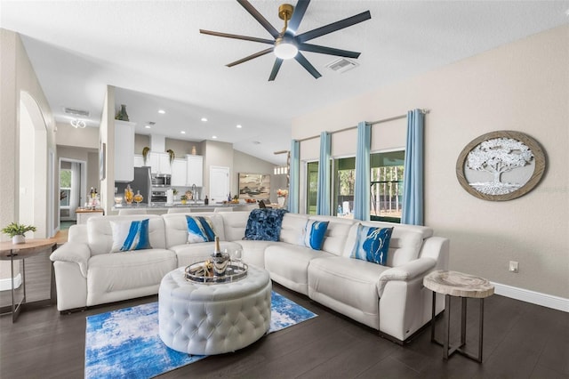 12333 Harris Hawk Rd, Weeki Wachee, FL 34614 - living area with a ceiling fan, dark wood-style floors, arched walkways, and recessed lighting