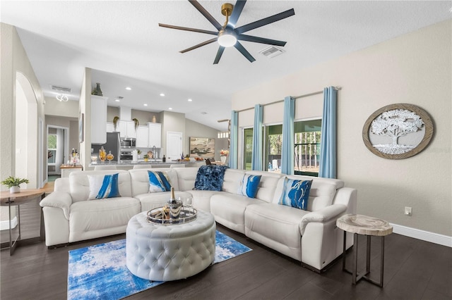 12333 Harris Hawk Rd, Weeki Wachee, FL 34614 - living area with ceiling fan, dark wood-style flooring, arched walkways, recessed lighting, and vaulted ceiling