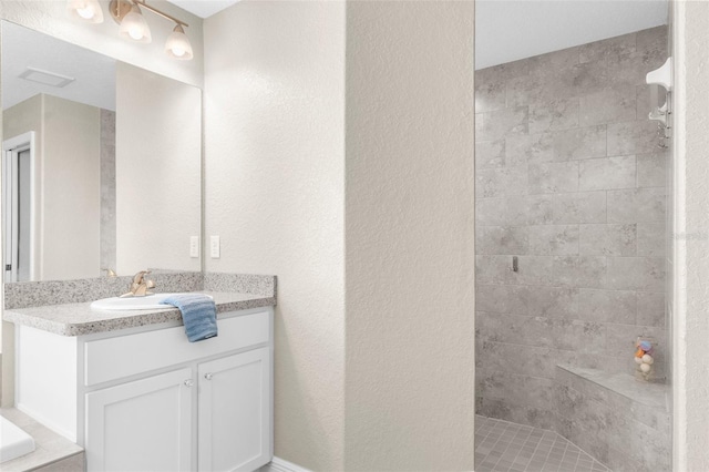 12333 Harris Hawk Rd, Weeki Wachee, FL 34614 - bathroom featuring vanity and a tile shower