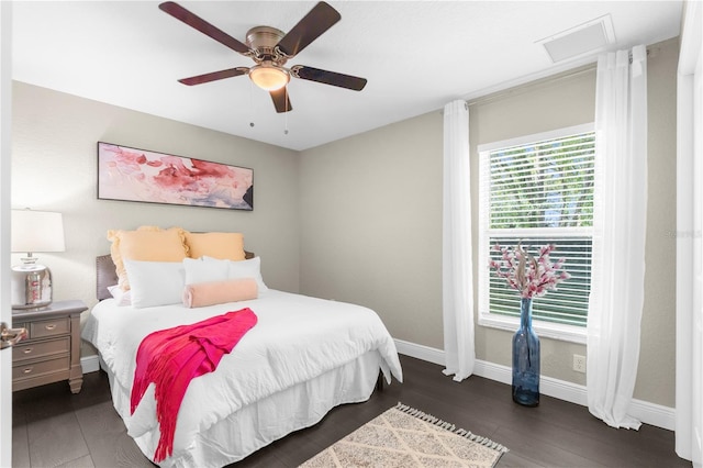 12333 Harris Hawk Rd, Weeki Wachee, FL 34614 - bedroom with attic access, wood finished floors, and a ceiling fan