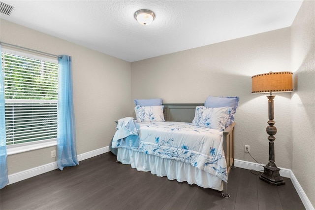 12333 Harris Hawk Rd, Weeki Wachee, FL 34614 - bedroom with wood finished floors and baseboards