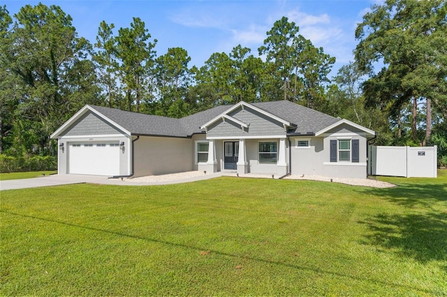 12333 Harris Hawk Rd, Weeki Wachee, FL 34614 - view of front of property featuring a garage, driveway, stucco siding, and roof with shingles