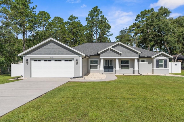 12333 Harris Hawk Rd, Weeki Wachee, FL 34614 - view of front of property with stucco siding, an attached garage, and driveway