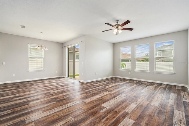 12322 Eagle Swoop Pl, Riverview, FL 33579 - empty room with dark wood-style flooring, a chandelier, and ceiling fan