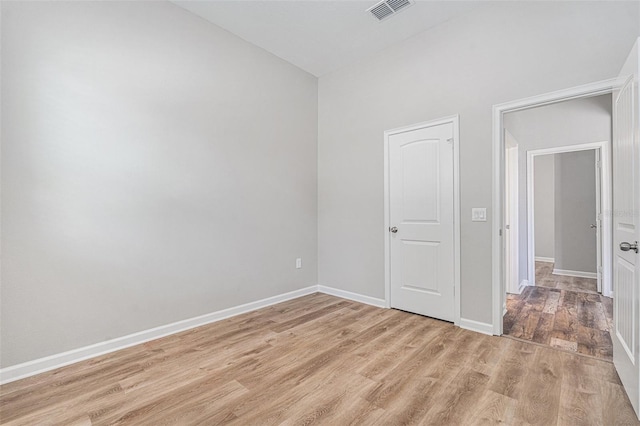 12322 Eagle Swoop Pl, Riverview, FL 33579 - unfurnished bedroom featuring light wood finished floors and baseboards