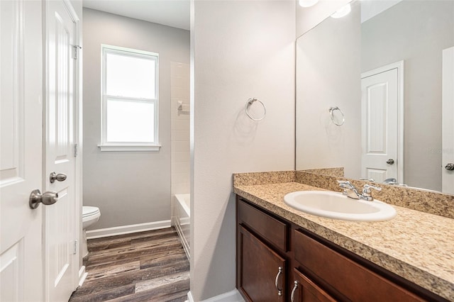 12322 Eagle Swoop Pl, Riverview, FL 33579 - bathroom featuring wood finished floors, vanity, and bathtub / shower combination