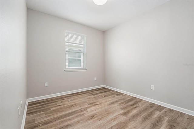 12322 Eagle Swoop Pl, Riverview, FL 33579 - spare room with wood finished floors and baseboards