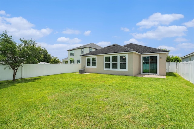 12322 Eagle Swoop Pl, Riverview, FL 33579 - rear view of house with stucco siding, a fenced backyard, and roof with shingles