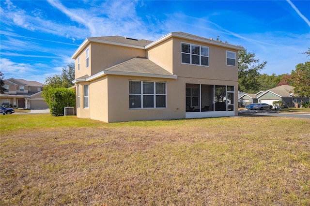 3921 SW 51st Ter, Ocala, FL 34474 - back of house featuring stucco siding, a yard, and a sunroom