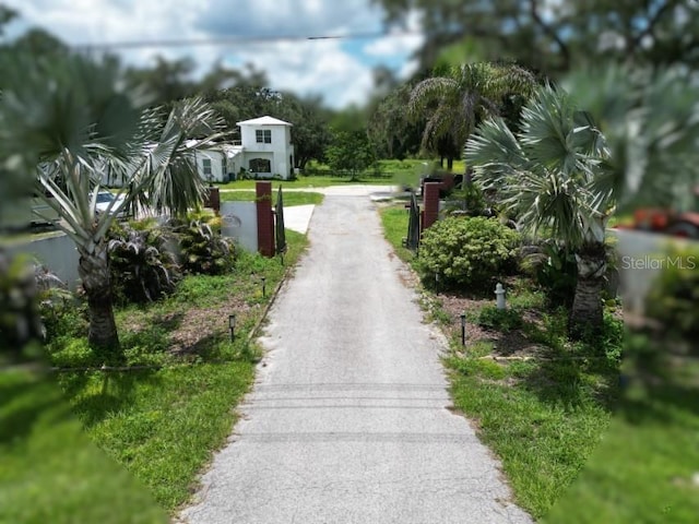 21921 US Highway 98, Dade City, FL 33523 - view of asphalt driveway with a gated entry