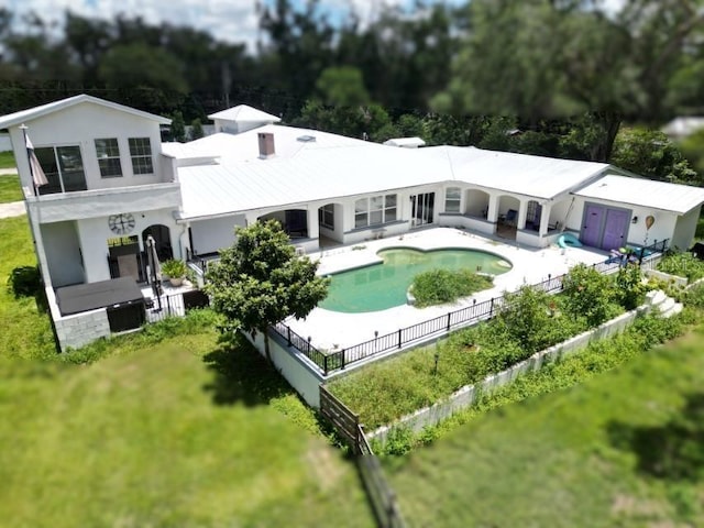 21921 US Highway 98, Dade City, FL 33523 - back of property featuring a patio, view of scattered trees, and stucco siding