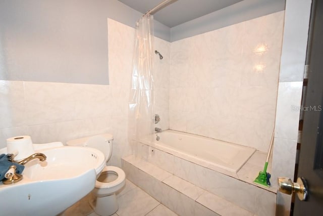 21921 US Highway 98, Dade City, FL 33523 - bathroom with tile walls, tiled shower / bath combo, and tile patterned flooring