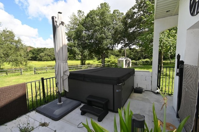 21921 US Highway 98, Dade City, FL 33523 - fenced backyard with a hot tub, a shed, a patio area, and view of scattered trees