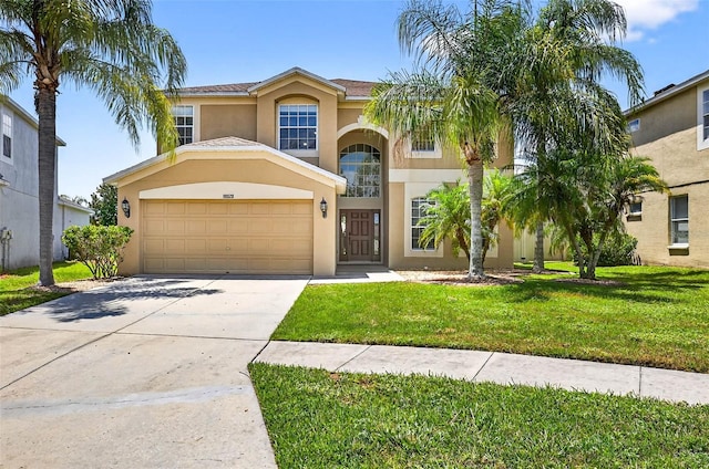 19028 Narimore Dr, Land O Lakes, FL 34638 - view of front facade featuring stucco siding, an attached garage, a front yard, and driveway