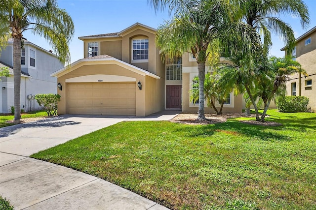 19028 Narimore Dr, Land O Lakes, FL 34638 - view of front of property featuring stucco siding, concrete driveway, a front lawn, and a garage