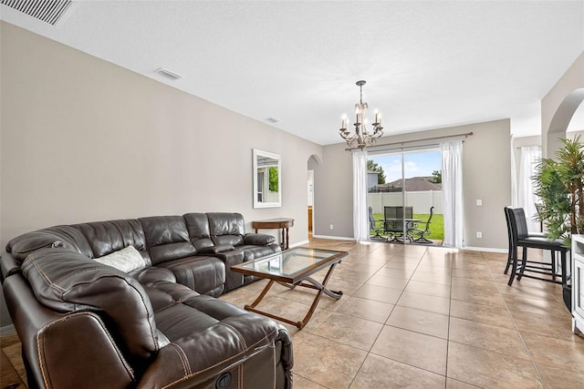 19028 Narimore Dr, Land O Lakes, FL 34638 - living room with arched walkways, a chandelier, and light tile patterned floors