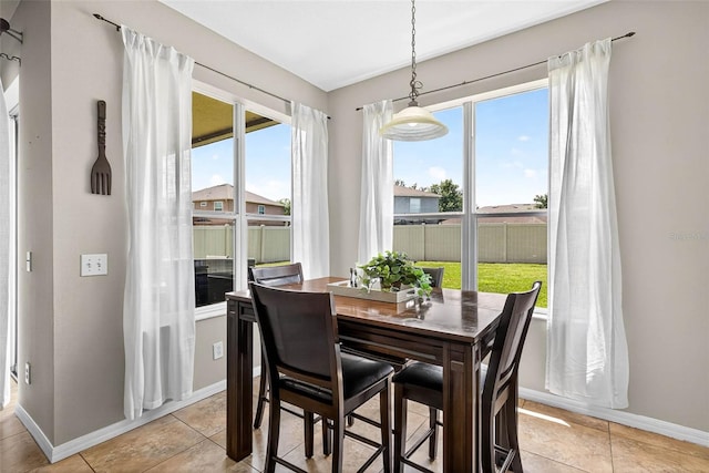 19028 Narimore Dr, Land O Lakes, FL 34638 - dining space with baseboards and light tile patterned floors