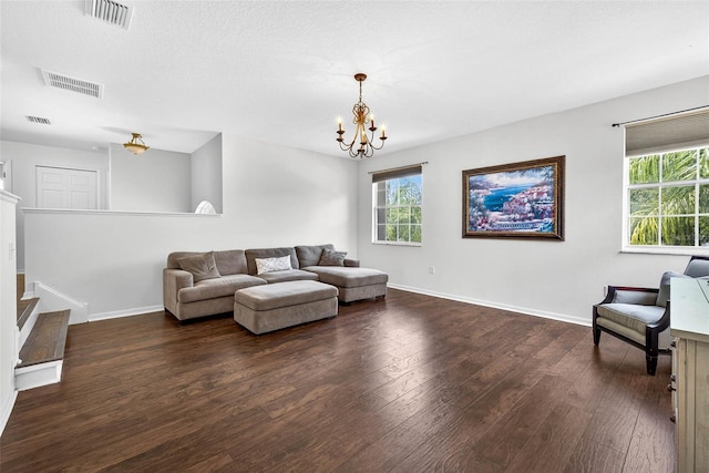 19028 Narimore Dr, Land O Lakes, FL 34638 - living area with dark wood finished floors, a chandelier, and stairs