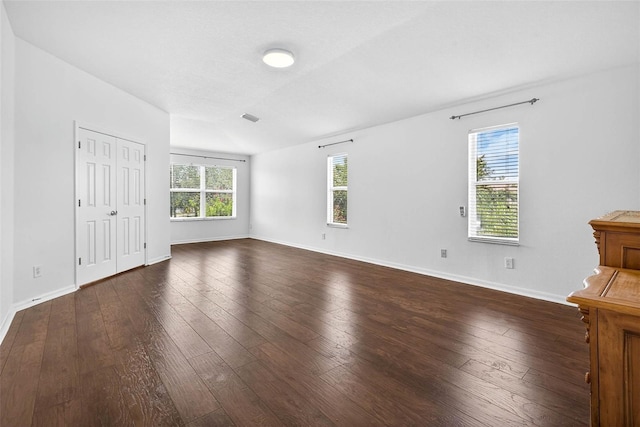 19028 Narimore Dr, Land O Lakes, FL 34638 - unfurnished bedroom featuring dark wood-style floors