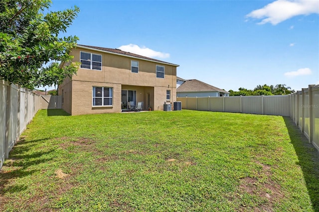 19028 Narimore Dr, Land O Lakes, FL 34638 - rear view of property with stucco siding and a fenced backyard