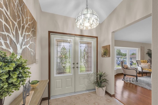 2174 Kent Ave, Clearwater, FL 33764 - foyer featuring french doors, a chandelier, and lofted ceiling