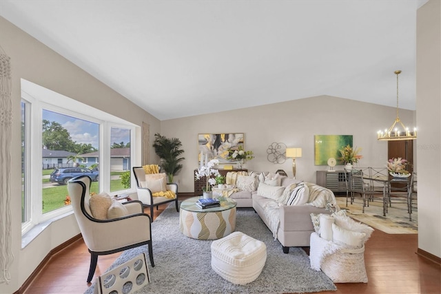 2174 Kent Ave, Clearwater, FL 33764 - living room with lofted ceiling, wood finished floors, and a chandelier