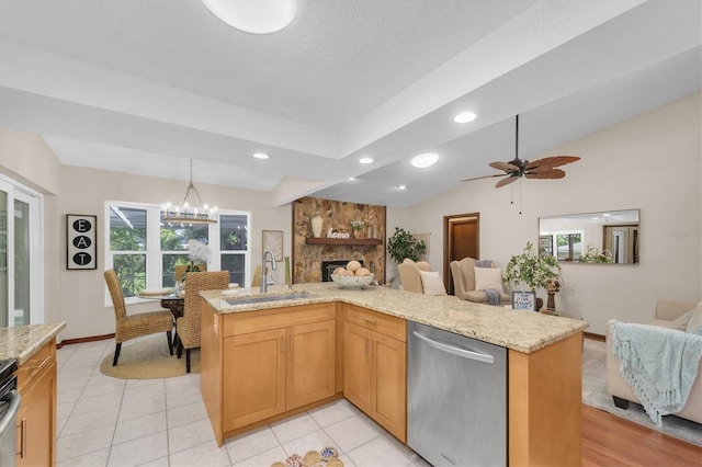 2174 Kent Ave, Clearwater, FL 33764 - kitchen with dishwasher, open floor plan, a fireplace, recessed lighting, and light stone counters
