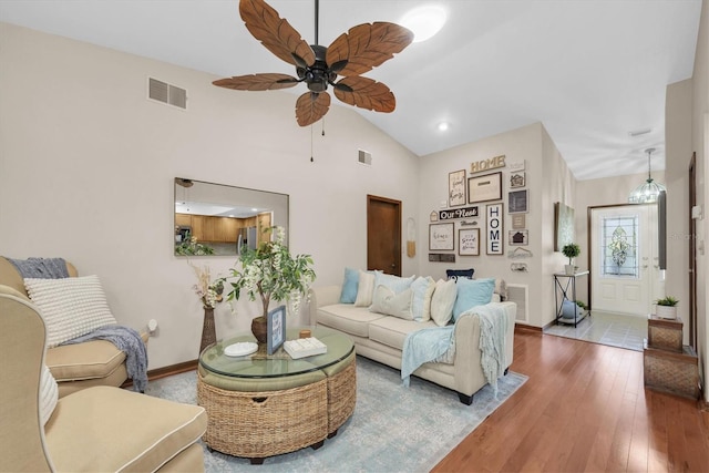 2174 Kent Ave, Clearwater, FL 33764 - living room featuring a ceiling fan, hardwood / wood-style floors, and vaulted ceiling